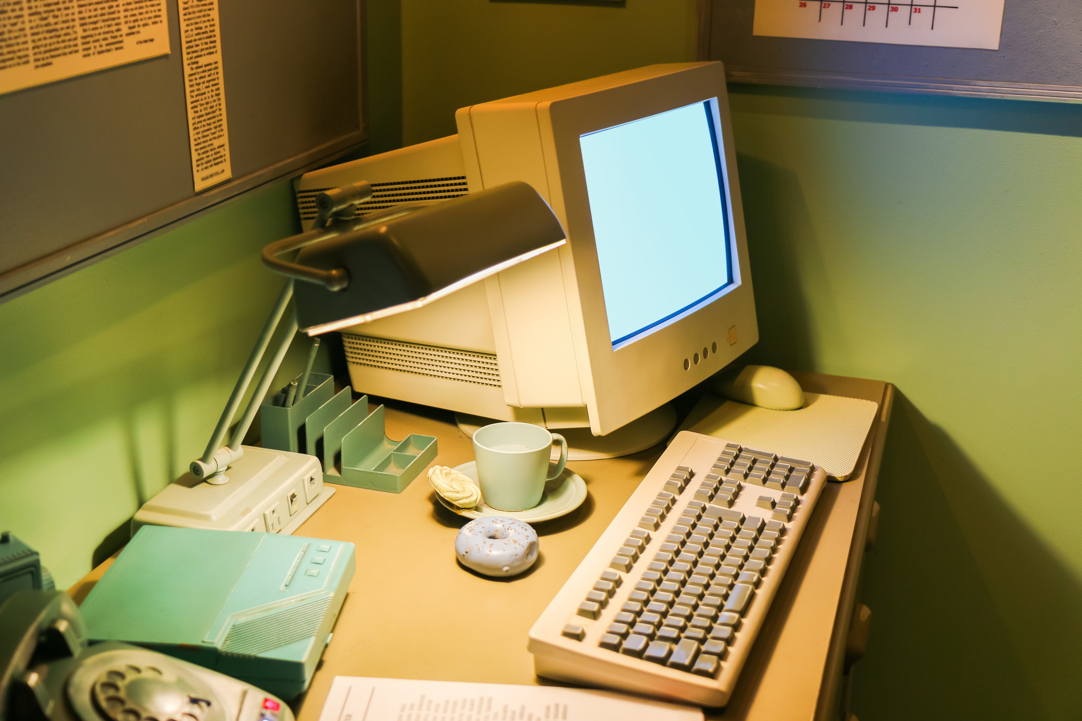 90s computer Old 90s computer with keyboard and lit up lamp.
