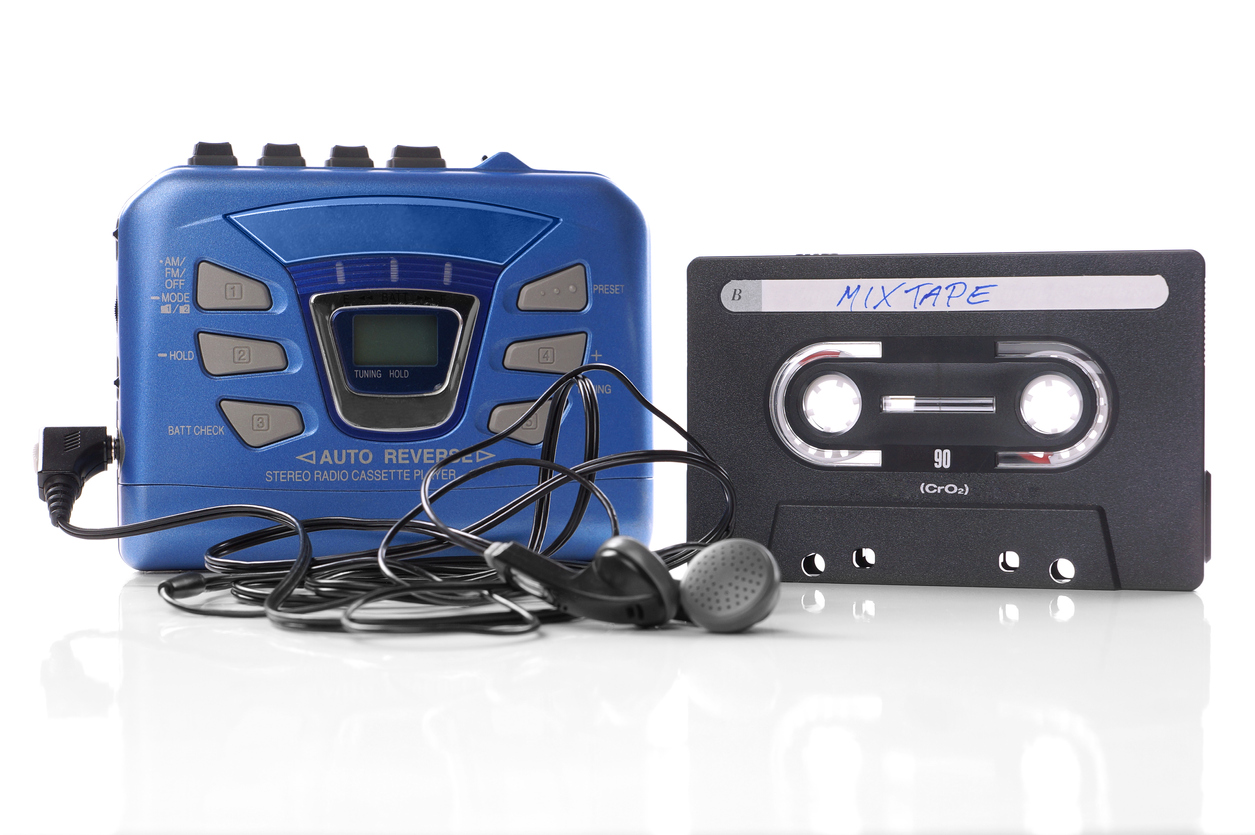 90s gadgets Walkman with earphones and cassette tape