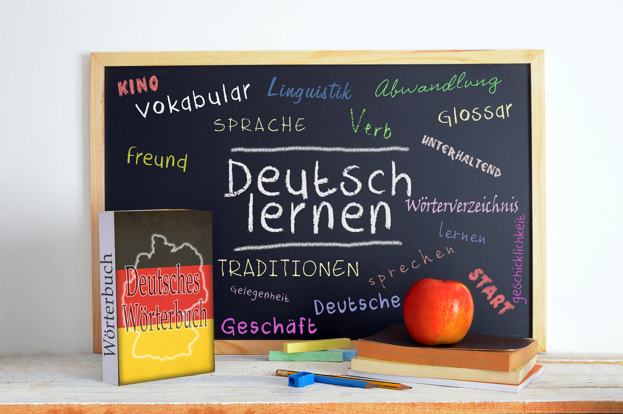 A blackboard full of handwritten German words.